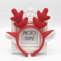 Cute red plush reindeer antler headband for Christmas decor shown on a white background - Red Christmas Antlers