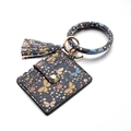 Detail of blue butterfly pattern card holder with gold hardware and wristlet ring - Butterfly