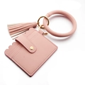 Macro shot of pink lychee leather card holder with scalloped edges and gold snap button - Pink