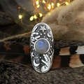 Macro detail of moonstone magic ring with celestial star and crescent moon carvings - Moonstone