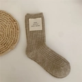 Knitted oat wool crew socks with ribbed texture and minimalist woven brand label - Camel