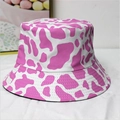 Pink and white cow print bucket hat featuring a trendy reversible outdoor casual design - M / Pink Cow Print