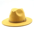 Close-up of mustard yellow fedora hat showing checkered texture and brown leather strap - Yellow
