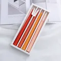 Set di 4 candele profumate a stelo sfumate arancioni da 25cm con design minimalista - Arancione Sfumato (Profumo all'Arancia Rossa)
