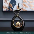Modern black and gold ceramic abstract sculpture with golden sphere, size 16x6x31cm - Morning Song Tall Style Black Gold - Large