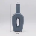 Matte grey-blue ceramic geometric flower vase with a hollow center oval sculpture design - 11x25cm / Gray Blue