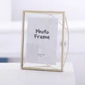 Modern gold 7-inch ginkgo leaf photo frame with geometric metal stand and glass - Geometric Gold Frame - 7 Inch / Gold
