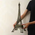 Eiffel Tower model 48cm in bronze metal finish held by hands for size reference - Bronze - 48CM Tower