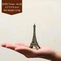 Compact 8cm bronze Eiffel Tower miniature figurine held in hand for scale - Bronze - 8CM Tower