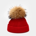 Detailed knit texture of a red winter hat featuring a fluffy faux fur pompom detail - Kids 50-53cm(1-5 Years) / Red