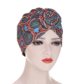 Detail showing the spiral knot and multi-color ethnic print on this twisted turban hat - M / Lake Blue Large Circle Print