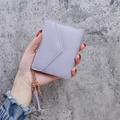 Short lavender faux leather envelope wallet with textured grain and tassel pendant - Purple