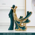 Modern abstract ceramic couple sculpture in dark green and gold for home decor - Couple Embrace