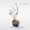 Modern gold hollow ceramic vase with pink magnolia flowers for luxury home decor - Gesang Vase + Pink Magnolia