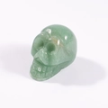 Mini green natural stone skull figurine with smooth jade texture and carved details - Green Aventurine