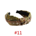 Close-up of green and red plaid fabric headband with white snowflake patterns and knot detail - Green Beige Red Plaid Snowflake #11