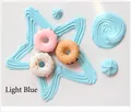 Tre mini ciambelle in resina blu chiaro con texture zuccherata per decorazioni fai-da-te - Azzurro