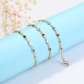 Golden bracelet with colorful star-shaped enamel charms and round lobster clasp - Pentagram