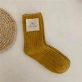 Mustard yellow thick wool knit socks with small fabric label in soft cashmere texture - Turmeric