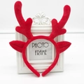 Christmas party headband with red plush reindeer antlers and ears on a white background - Red