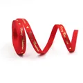 Detail of 10mm red grosgrain ribbon with gold Merry Christmas print and heart pattern - Red Gold Merry Christmas-100 Yards