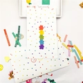 Flat lay of colorful rainbow bear stationery set with motivational English stickers - Polka Dot Bear Paper Bag / Medium