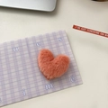 Cute candy-colored orange plush heart hair clip on a purple checkered card - Orange