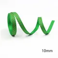 Close-up of 10mm green grosgrain ribbon with red star pattern for Christmas gift wrapping - Green Red Stars-100 Yards