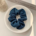 Navy blue ribbed organza scrunchie with pleated texture on decorative white tray - Dark Blue Twill
