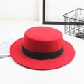Close-up of red felt flat top hat featuring a stylish black decorative ribbon band - One Size / Square Ribbon / Red