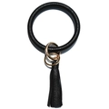 Close-up of black pebble leather keychain bangle with fringe tassel and gold hardware - Solid Black