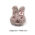 Close-up of grey plush rabbit charm with pink flower detail, size 6cm by 5cm - With Brooch Pin / Gray