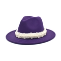 Detailed close-up of multi-layer pearl woven band on a deep purple wool fedora hat - Purple