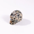Mini natural gemstone skull carving with orange and black spotted jasper texture - Dalmatian Jasper
