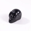 Polished black crystal skull figurine hand-carved minimalist gemstone sculpture - Obsidian