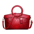 Red handbag with crocodile and lychee texture, golden ring handle and detachable strap - Red