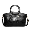 Black handbag with crocodile and lychee leather textures and golden circular handles - Black