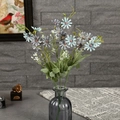 Artificial blue and purple daisies in a glass vase for minimalist home decor styling - Blue