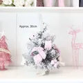 Pink mini table Christmas tree with snow flocked finish and decorative bows, 30cm height - 30cm Pink Christmas Tree