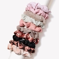 Set of 10 assorted fabric scrunchies in velvet and leopard print on white stand - Scrunchie / Leopard Pink