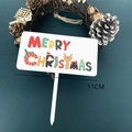 Detailed view of Merry Christmas acrylic cake topper featuring Santa and Reindeer motifs - White Base Style C