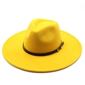 Detail of yellow wool felt fedora featuring a brown leather band and silver metal rivets - Yellow