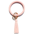 Close-up of pink lychee leather keychain bracelet with gold metal rings and tassel - Pink