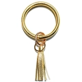 Detailed view of gold snakeskin leather keyring bracelet with fringe tassel charm - Gold