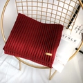 Thick burgundy chunky knit scarf with handmade leather tag on a stylish chair - 175cm / Burgundy