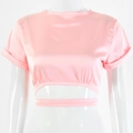 Detailed view of pink short sleeve crop top with waist hollow out and silk texture - S / Pink