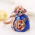 Blue enamel lucky pouch keychain with rose gold frame and prosperity character - Royal Blue Fortune Bag