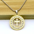Macro shot of gold micro-pave cross pendant with sparkling crystals and silver bead chain - Necklace / Gold