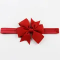 Elastic baby headband featuring a large layered red grosgrain ribbon fishtail bow - Red