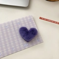 Cute purple plush heart-shaped hair clip for girls with soft fuzzy texture on white desk - Purple